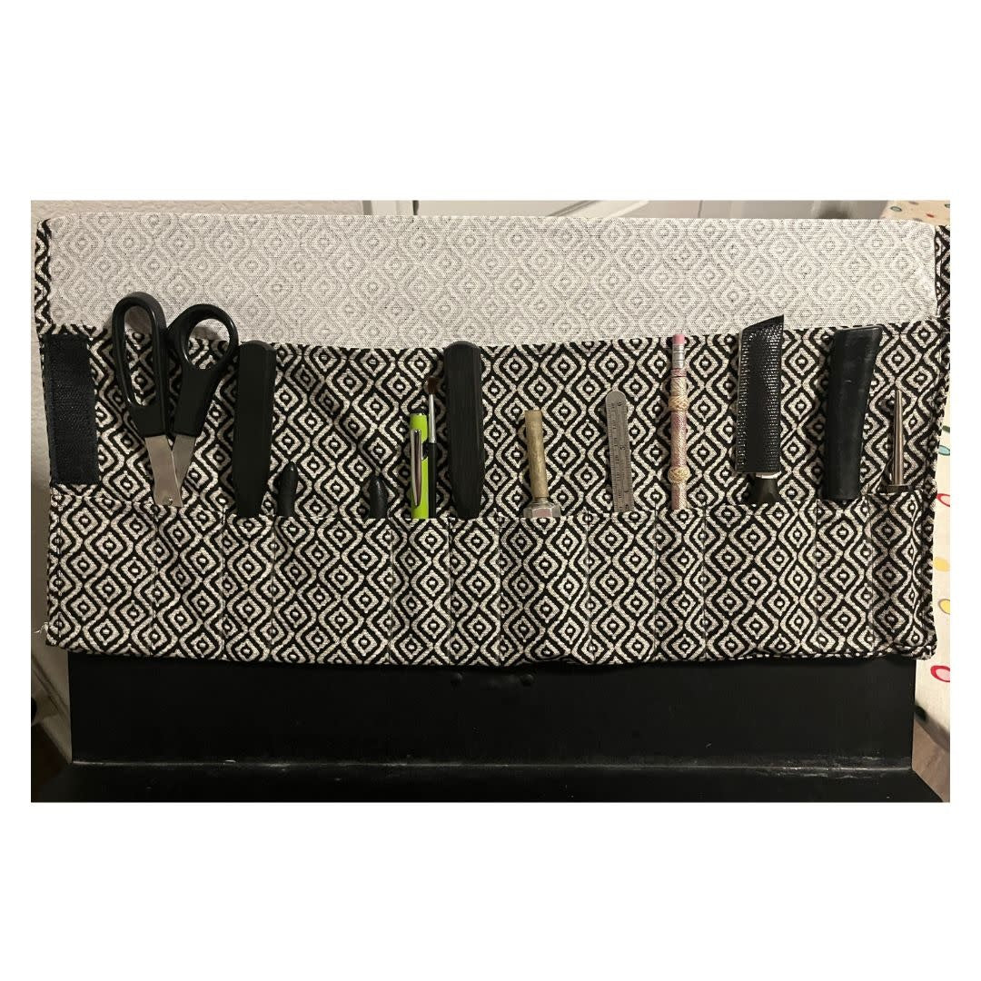 Tool Wrap Wallet Roll Hangs Over the Stand Brown Stripes
